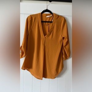Never worn mustard color blouse
